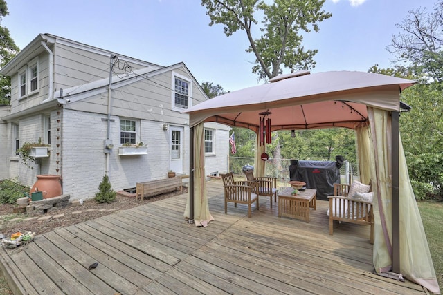 wooden deck featuring a gazebo