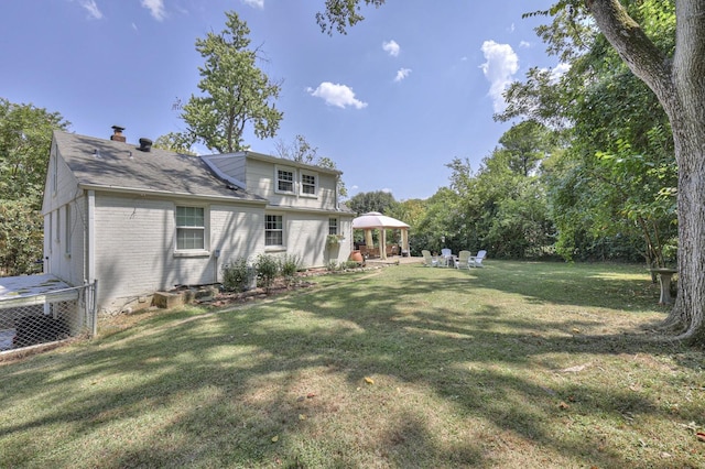 view of yard featuring a gazebo and a patio