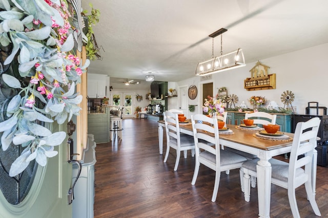 dining space with wood finished floors