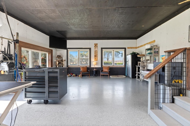 interior space with stairway and speckled floor