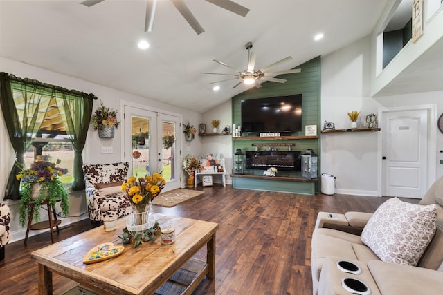 living area featuring hardwood / wood-style flooring, recessed lighting, a fireplace, ceiling fan, and vaulted ceiling