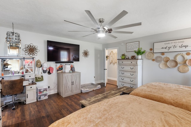 bedroom with baseboards, a textured ceiling, wood finished floors, and a ceiling fan