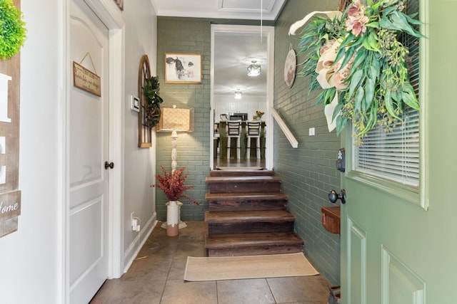 staircase with attic access and tile patterned flooring