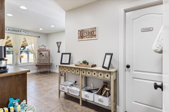 interior space with recessed lighting and baseboards