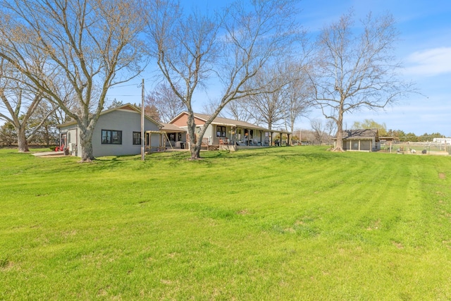 view of yard with covered porch