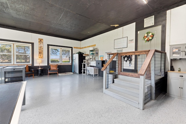 interior space with stairs and speckled floor