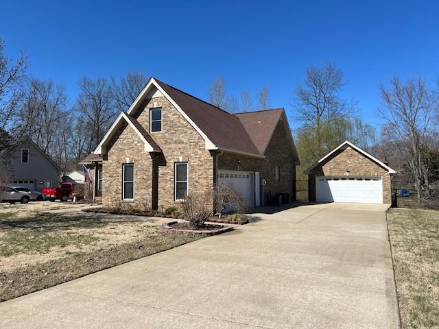 view of front of home with brick siding and driveway