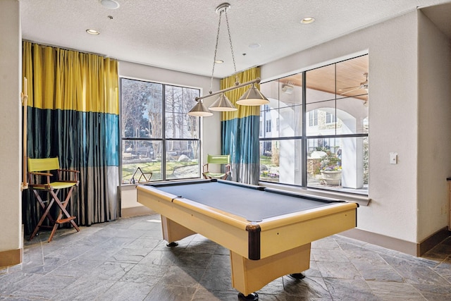 rec room with stone tile flooring, recessed lighting, a textured ceiling, and billiards