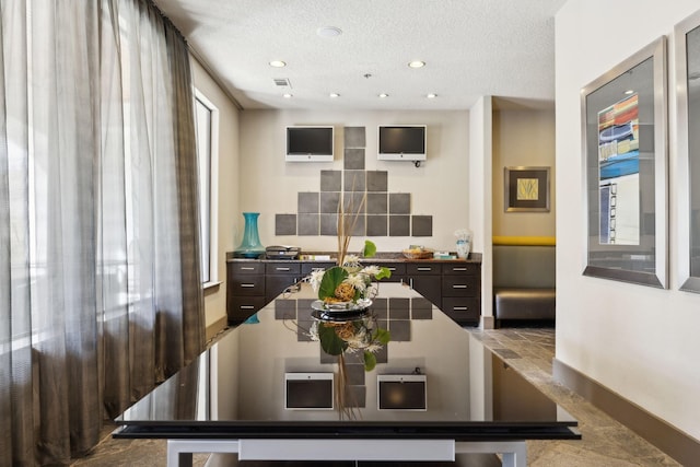 dining area featuring recessed lighting, visible vents, baseboards, and a textured ceiling