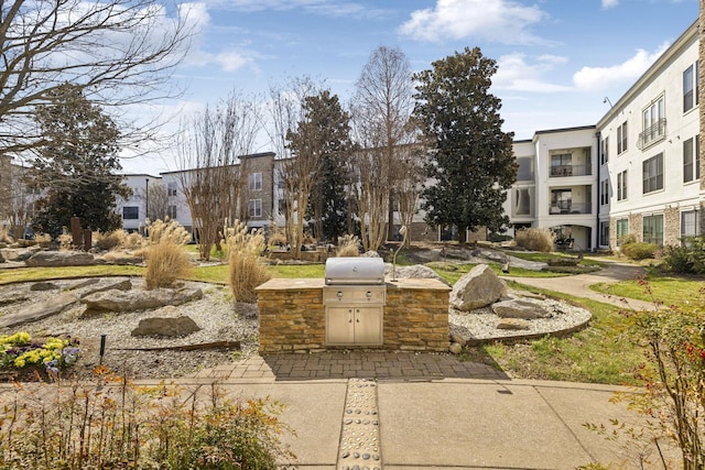 view of community featuring a residential view and exterior kitchen