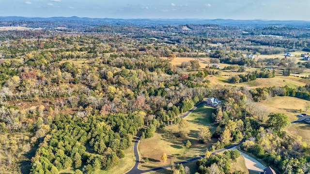 aerial view featuring a view of trees