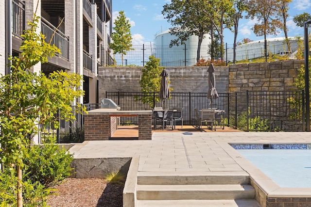 view of patio featuring fence