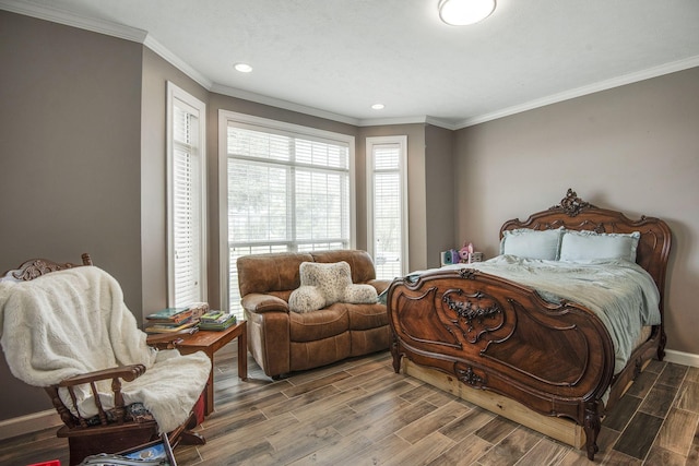 bedroom featuring recessed lighting, ornamental molding, baseboards, and wood finished floors