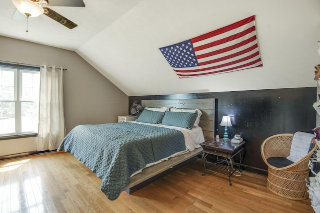 bedroom featuring vaulted ceiling, ceiling fan, and wood finished floors