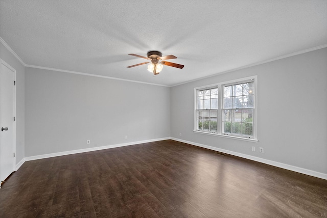 spare room featuring visible vents, dark wood-style floors, ceiling fan, and crown molding