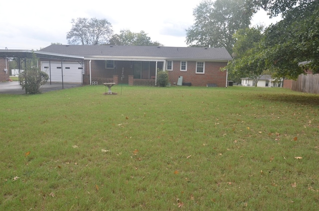 back of house featuring brick siding, a garage, a lawn, and driveway