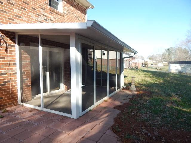 view of patio / terrace featuring a sunroom