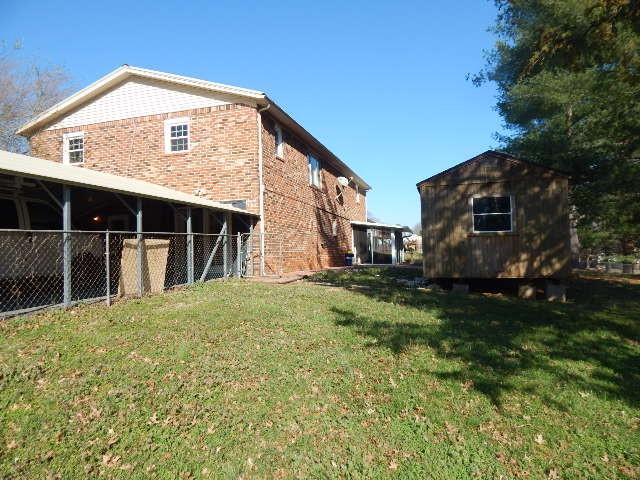 exterior space with a storage unit and an outbuilding