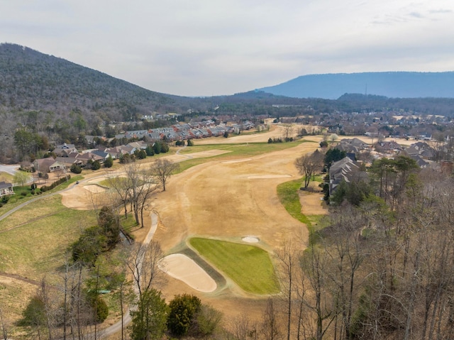 drone / aerial view with a mountain view, a residential view, and golf course view