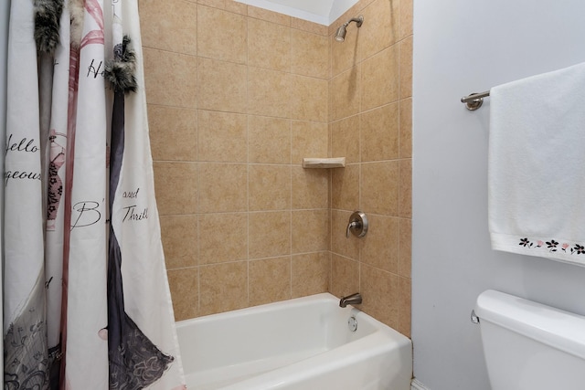 bathroom with toilet and shower / bath combo