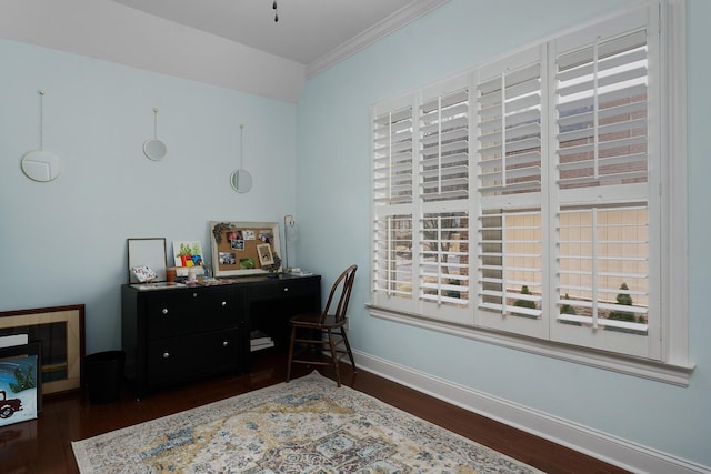 office space featuring dark wood finished floors, crown molding, baseboards, and a wealth of natural light