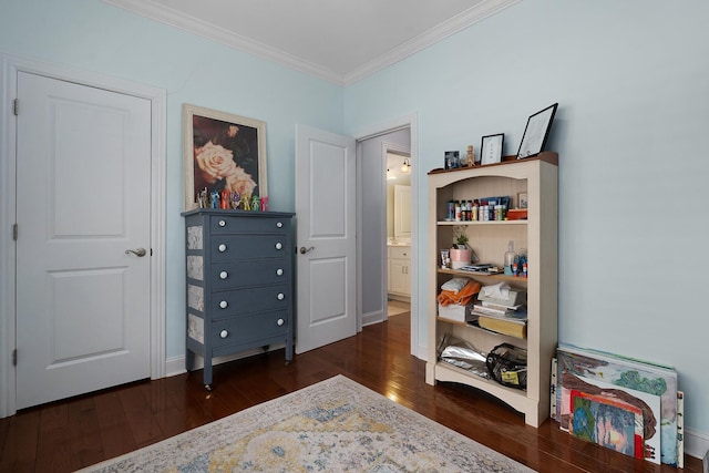 interior space featuring crown molding, baseboards, and dark wood-style flooring