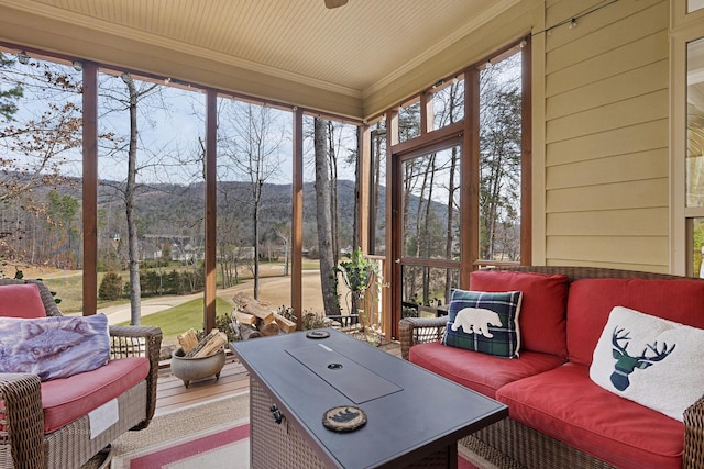 sunroom with a mountain view