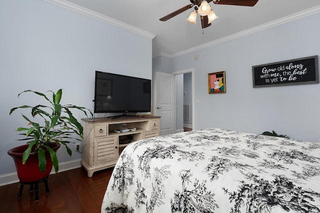 bedroom featuring baseboards, a ceiling fan, dark wood finished floors, and crown molding