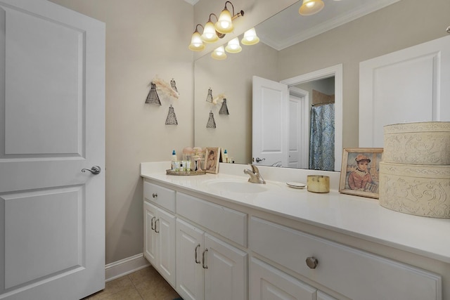 full bath featuring tile patterned flooring, vanity, crown molding, and baseboards