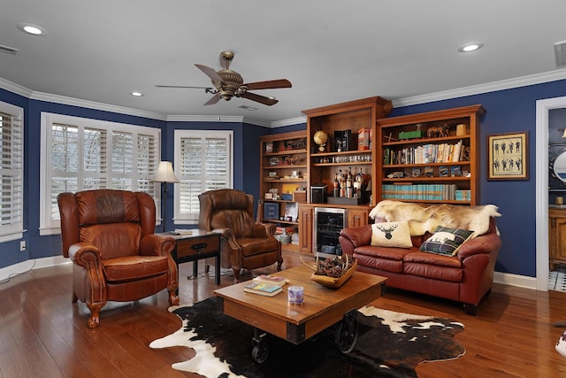 living area with crown molding, wine cooler, recessed lighting, wood finished floors, and a ceiling fan