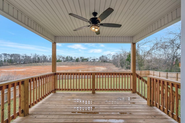 deck featuring a lawn and ceiling fan