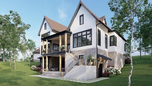 rear view of house with stairway, a lawn, and a balcony