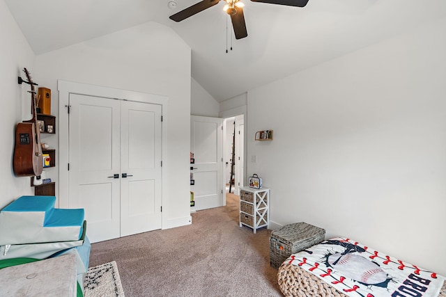 bedroom with lofted ceiling, a ceiling fan, a closet, and carpet floors