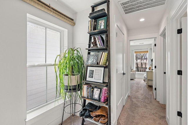 hallway with recessed lighting, visible vents, and carpet floors