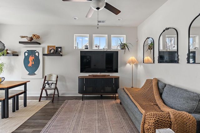 living area with visible vents, ceiling fan, baseboards, recessed lighting, and wood finished floors