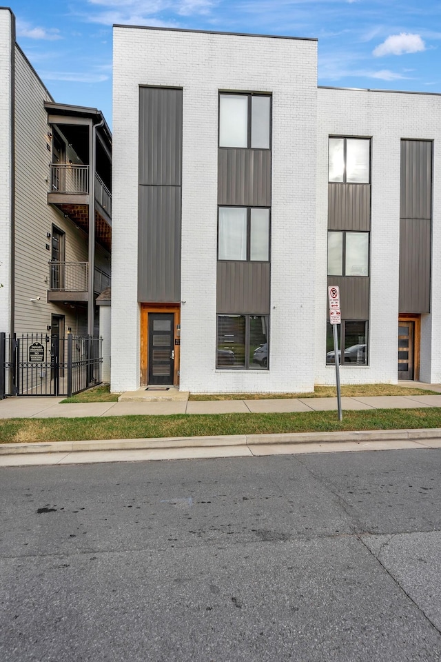 view of building exterior featuring fence