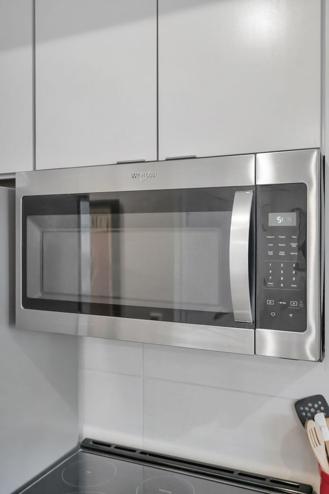 interior details featuring stainless steel microwave