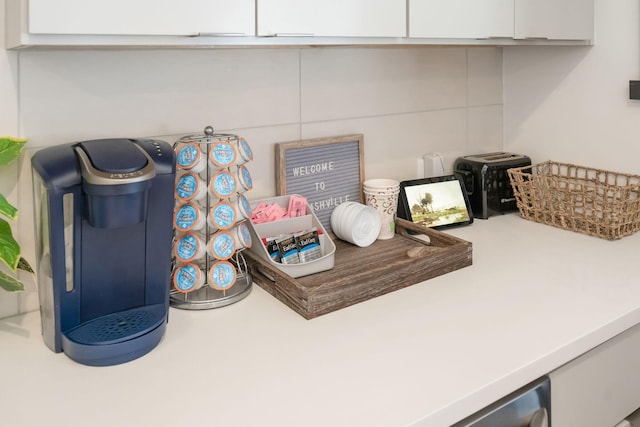 room details with white cabinetry and light countertops