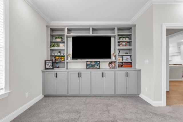 bar with baseboards, light colored carpet, and ornamental molding