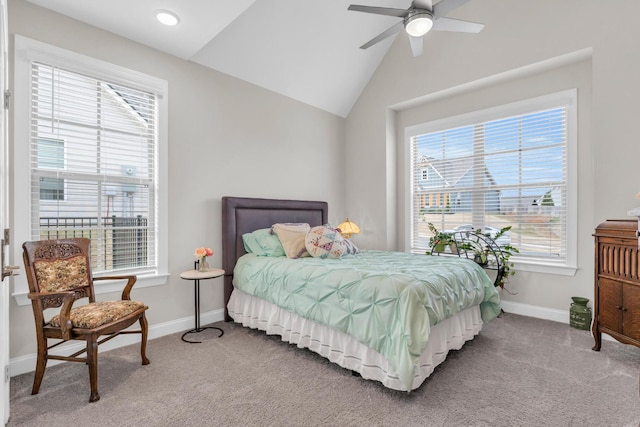 bedroom with baseboards, light colored carpet, a ceiling fan, and vaulted ceiling