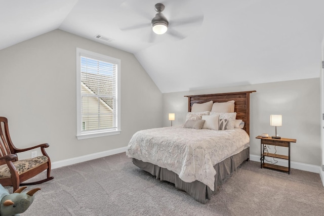 carpeted bedroom with lofted ceiling, baseboards, visible vents, and ceiling fan