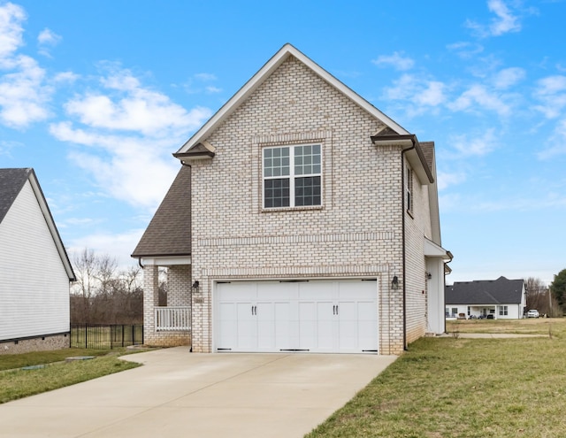 view of side of property featuring brick siding, a garage, concrete driveway, and a yard