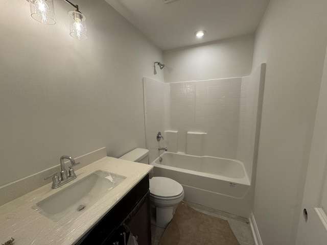 bathroom featuring tile patterned flooring, toilet, vanity, and washtub / shower combination