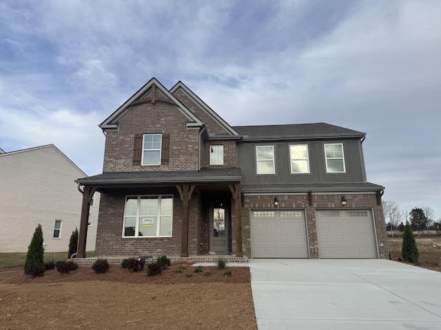 craftsman house featuring brick siding, board and batten siding, concrete driveway, covered porch, and a garage