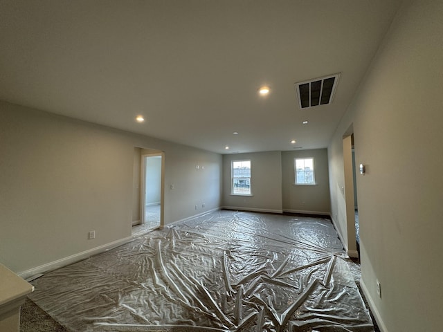 unfurnished room with visible vents, recessed lighting, and baseboards