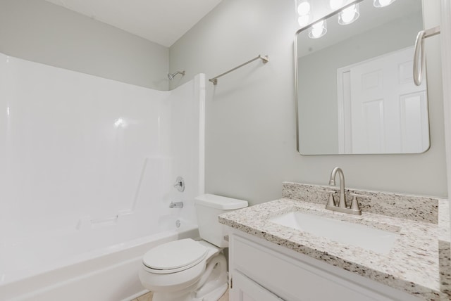 full bath featuring toilet, bathtub / shower combination, and vanity