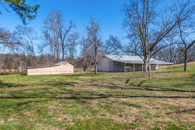 view of yard featuring an outbuilding and an outdoor structure