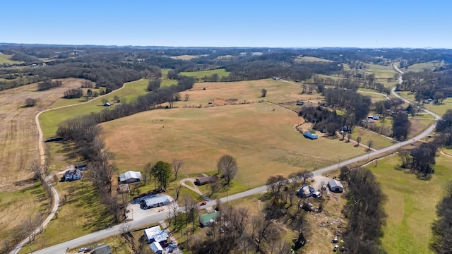 birds eye view of property with a rural view