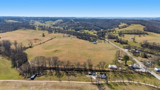 birds eye view of property with a rural view