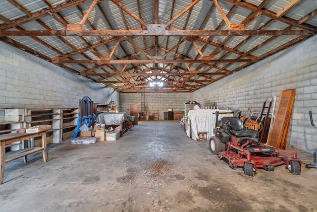 garage featuring metal wall and concrete block wall